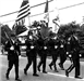 A group of police officers marching in a parade.