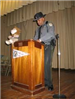 A police officer speaking at a podium